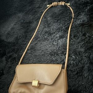 Tan Crossbody Bag with Gold Hardware and Flap Closure